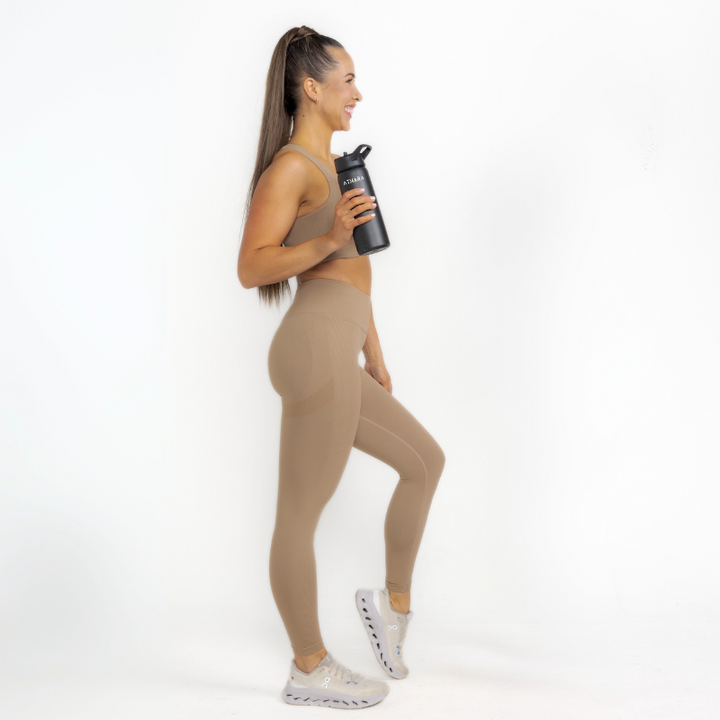 Athara MaxSculpt Leggings in Desert Tan – Full-length Side View Action