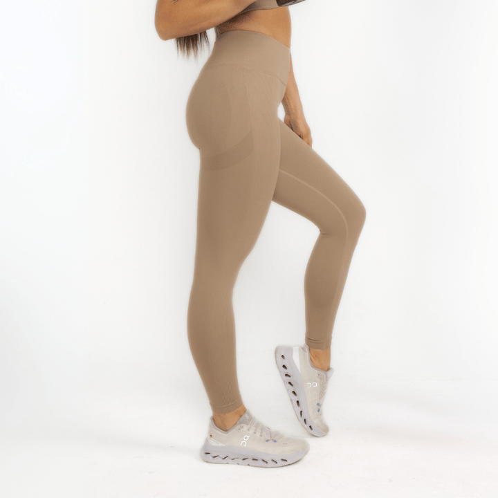 Athara MaxSculpt Leggings in Desert Tan – Side View Showing Fit