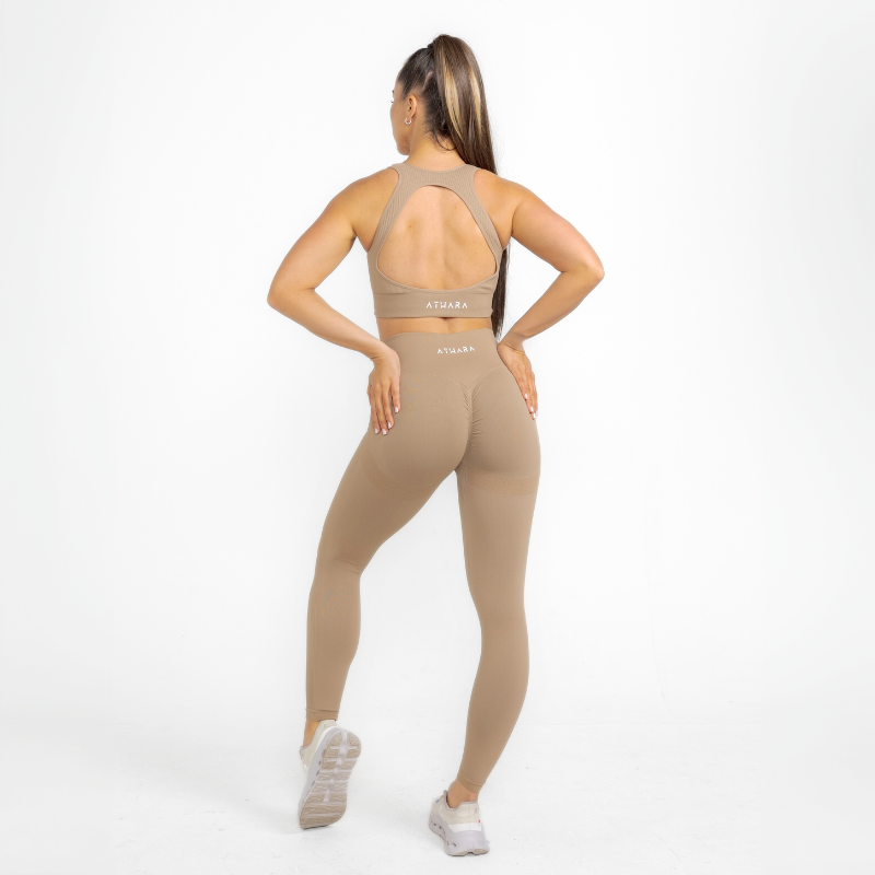 Athara MaxSculpt Leggings in Desert Tan – Full-Length Angle View on Model