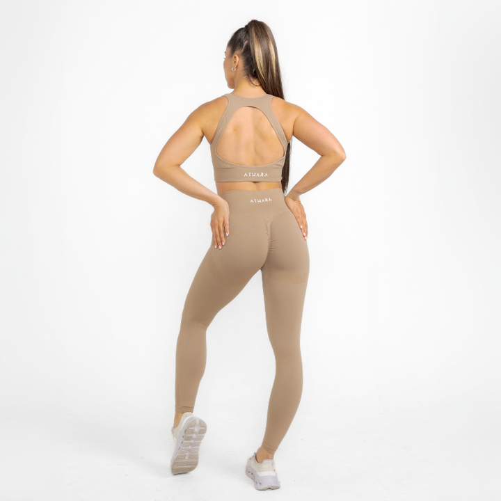Athara MaxSculpt Leggings in Desert Tan – Full-Length Angle View on Model